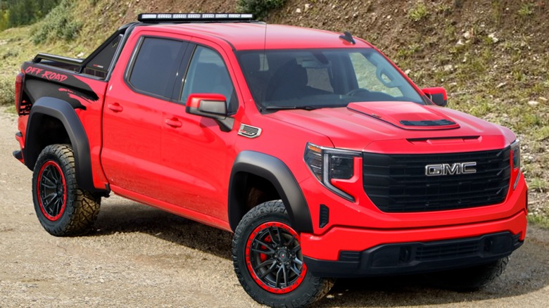Supercharged GMC Sierra on dirt road
