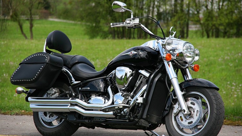Kawasaki Vulcan 2000 parked in front of grass