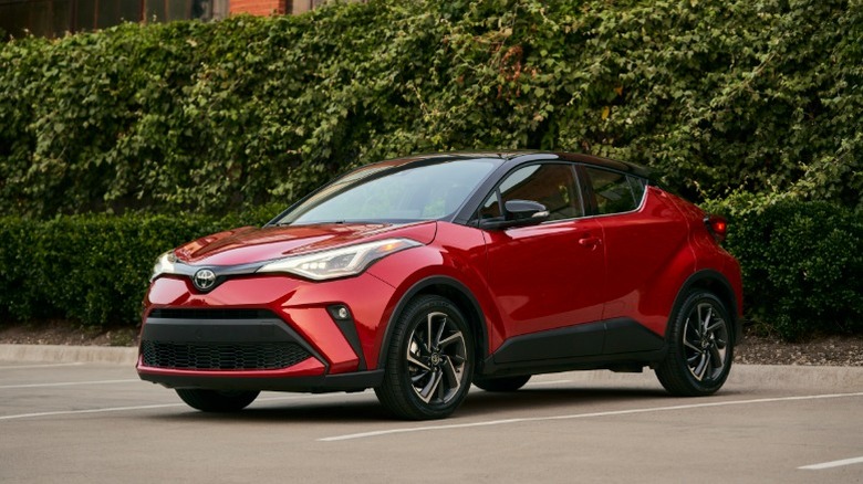 A red 2021 Toyota C-HR in a parking lot