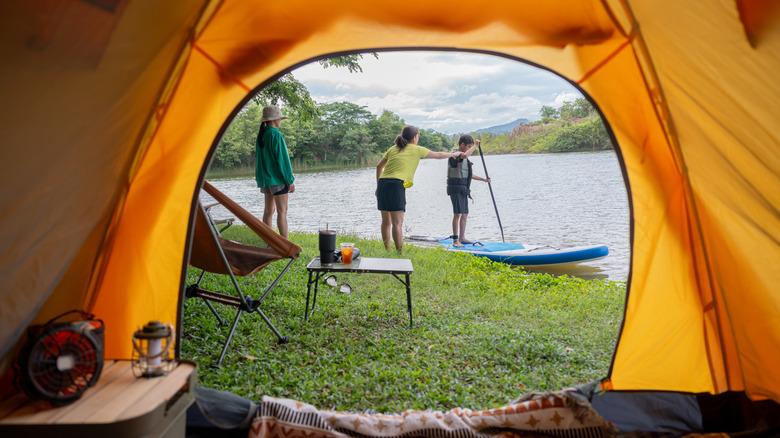 view of campers from inside the tent