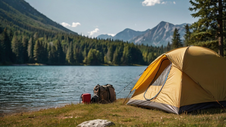 a tent set up near a lake