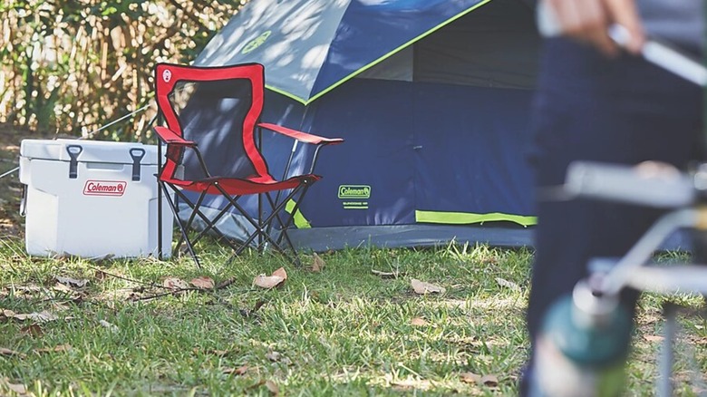 Coleman camping chair next to tent