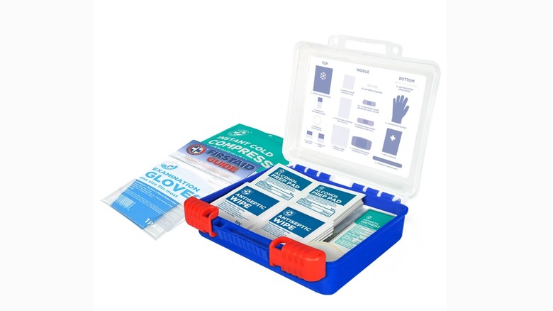 Open first aid kit box showing the various items inside