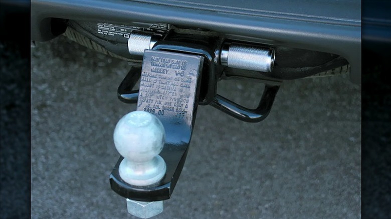 A ball mount lock hooked into the back of an RV.