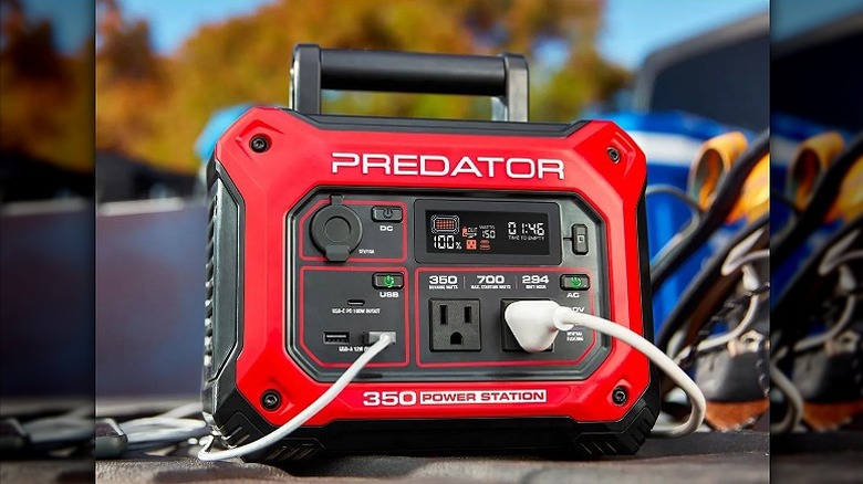 Red and black Predator power station connected to multiple devices.