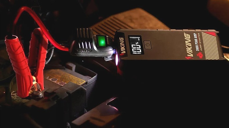A Viking jump starter connected to a battery.
