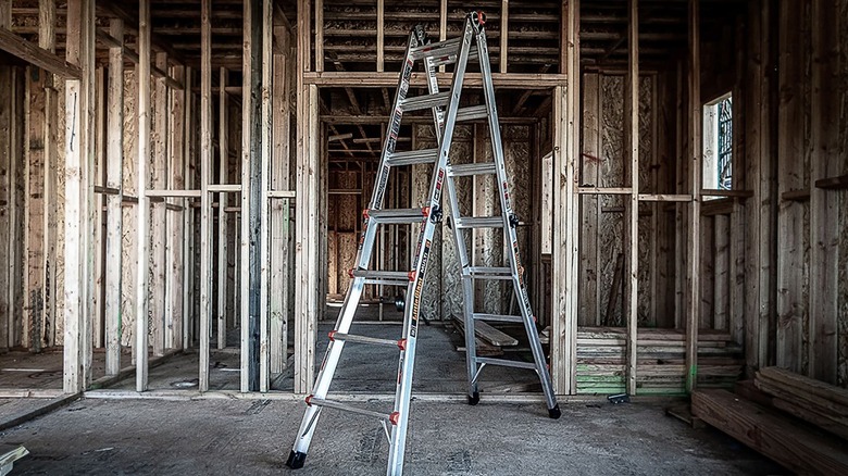 Little Giant Ladder in empty room in house in construction.