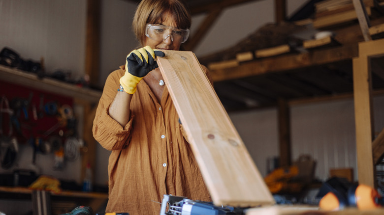 A person woodworking on a workbench