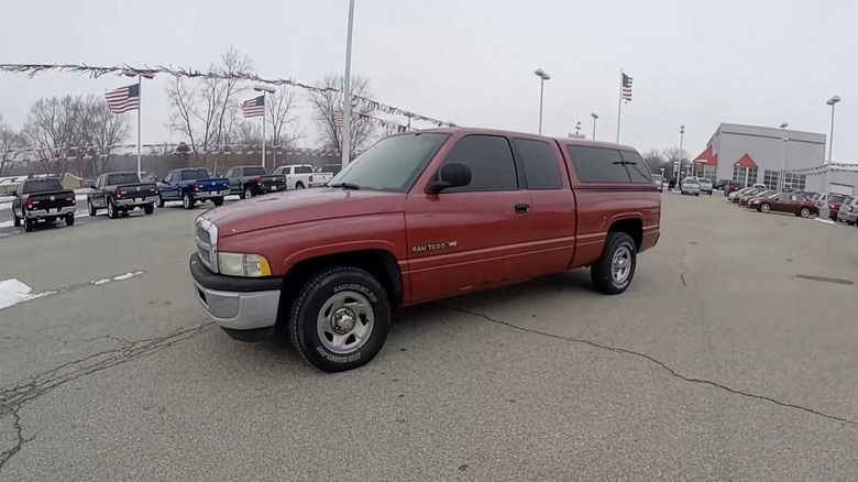 A side on shot of a red 1999 Dodge Ram 1500