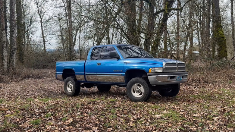 A side on shot of a blue 2001 Dodge Ram 1500