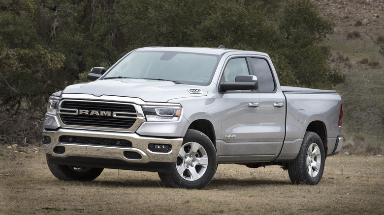 A side on shot of a silver 2019 Ram 1500 parked