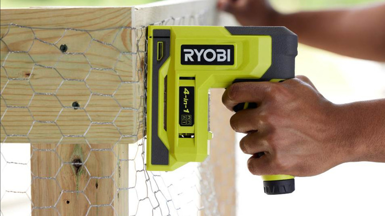 Using the 4-in-1 Craft Stapler/Nailer to install wire on wood.