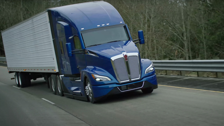 A Kenworth T680 truck driving along a highway