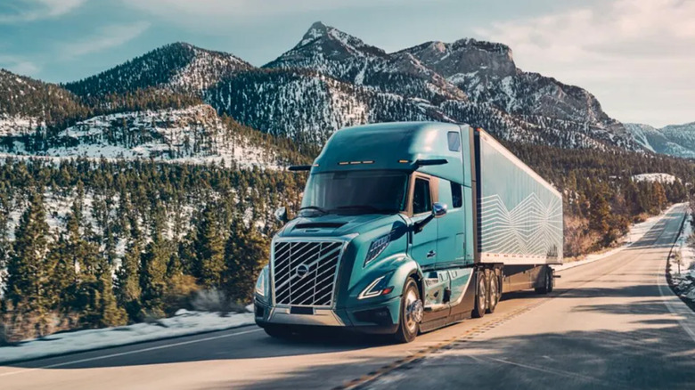 A Volvo VNL semi on a wintry mountain highway