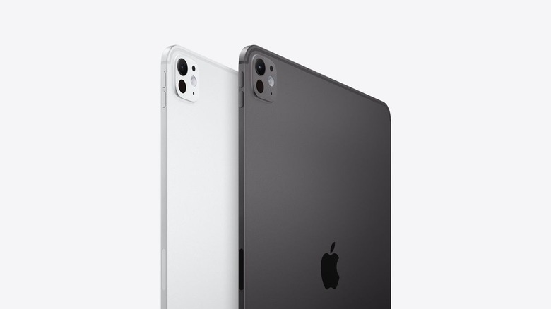 Two M5 Apple iPad Pro tablets, one white and one grayish-black, on a white background