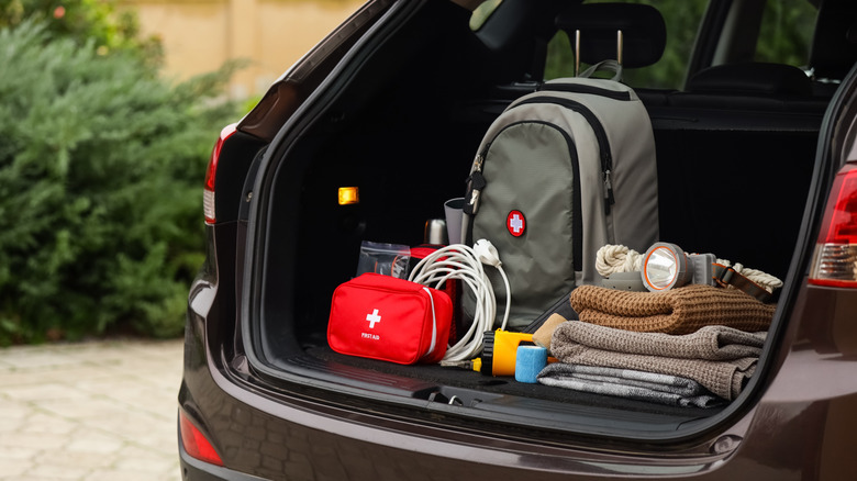 An emergency kit placed in the of a car.
