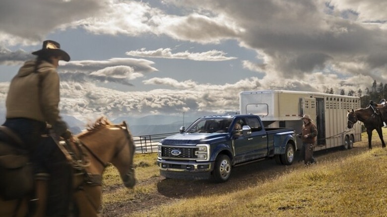 A Ford truck attached to a horse trailer