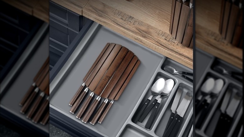 Foldable wooden knife block in a kitchen drawer