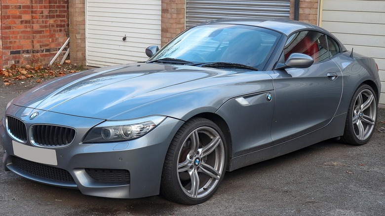 Grey BMW Z4 parked in front of garage
