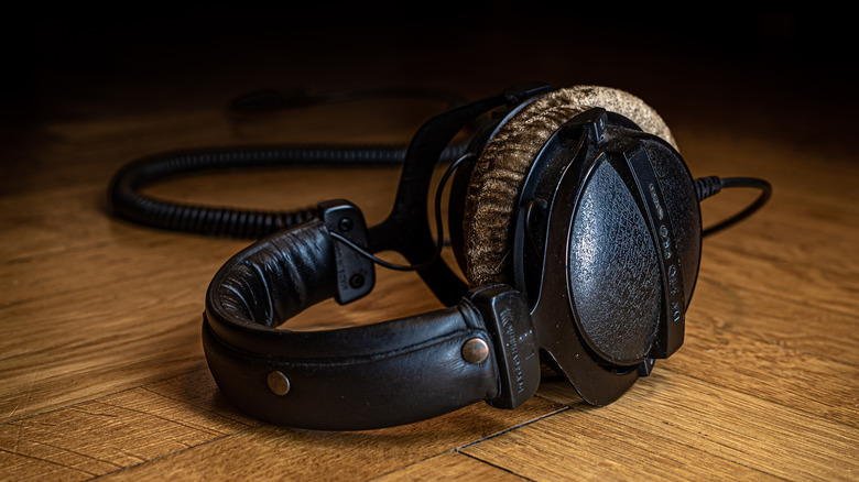 A pair of Beyerdynamic headphones placed on a wooden table