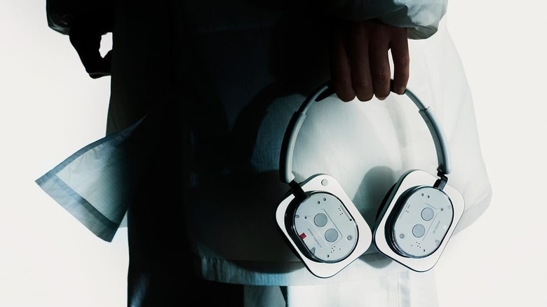 Nothing Headphone (1) held by a person