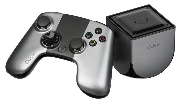 Ouya and its controller on a white background, the console considerably smaller than the controller.