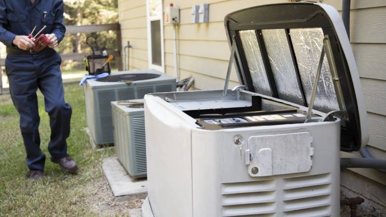 a technician about to service a generator