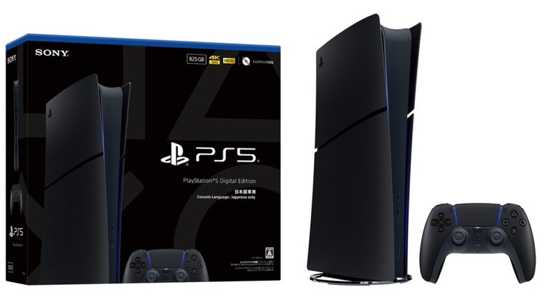An all-black special edition PlayStation 5, its box, and controller