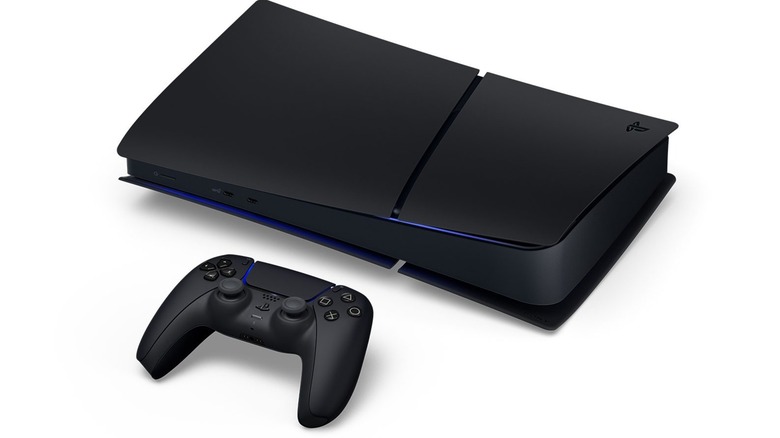 A 3D rendering of a black PlayStation 5 and its controller