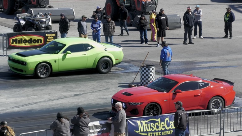 Dodge Challenger SRT Demon and Ford Mustang GT at drag strip