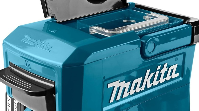 A Makita coffee maker being opened.