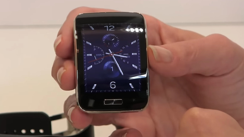 Person holding smartwatch