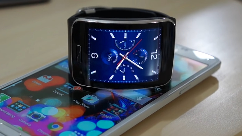 Galaxy Gear S on top of phone