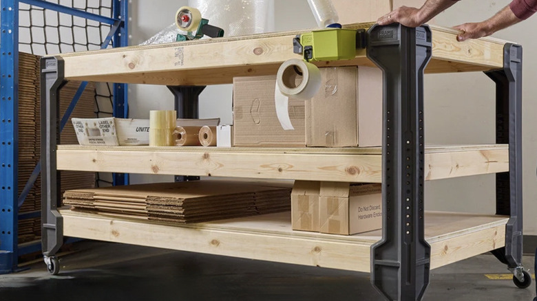 Person using Ryobi Framework as a heavy-duty push cart