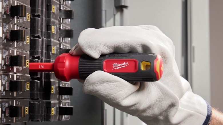 Person using Milwaukee's new screwdriver for electrical work