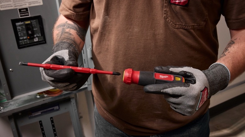 Person flipping the head of Milwaukee's new screwdriver