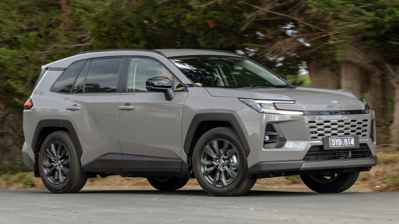 Gray Toyota RAV4 RAV4 GXL 2WD PHEV cornering on a rural road