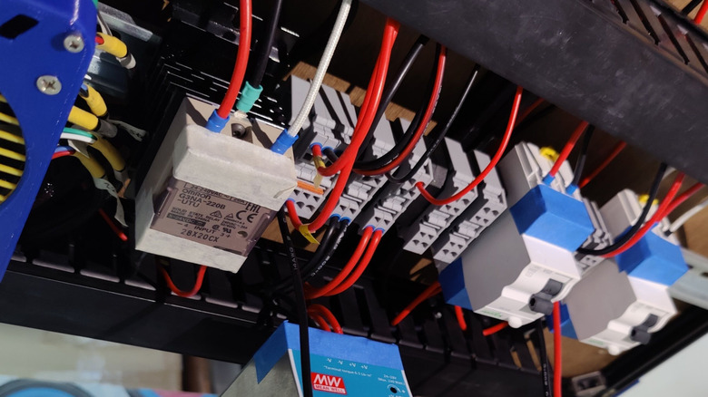 Electrical cables of various sizes inside a 3D printer electronics enclosure