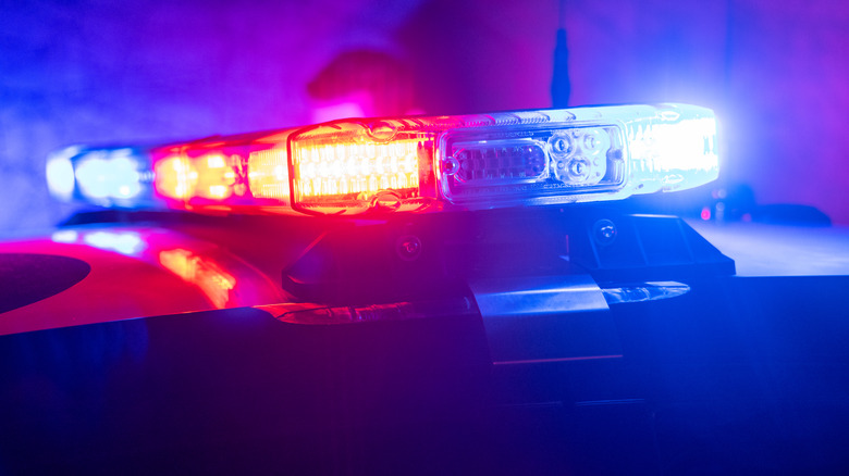 Police lights illuminated on top of car