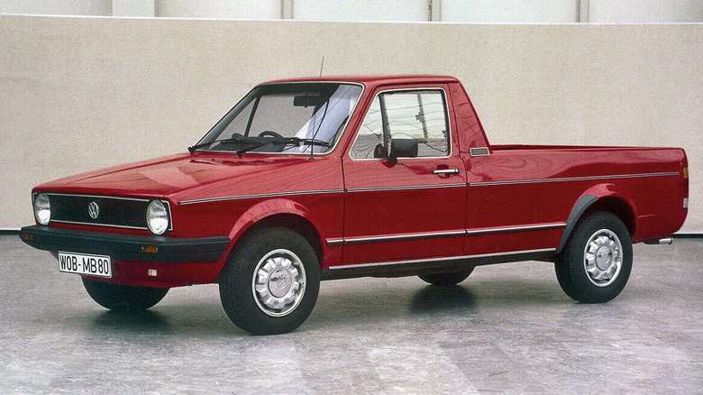 Red 1982 Volkswagen Caddy parked on marble flooring