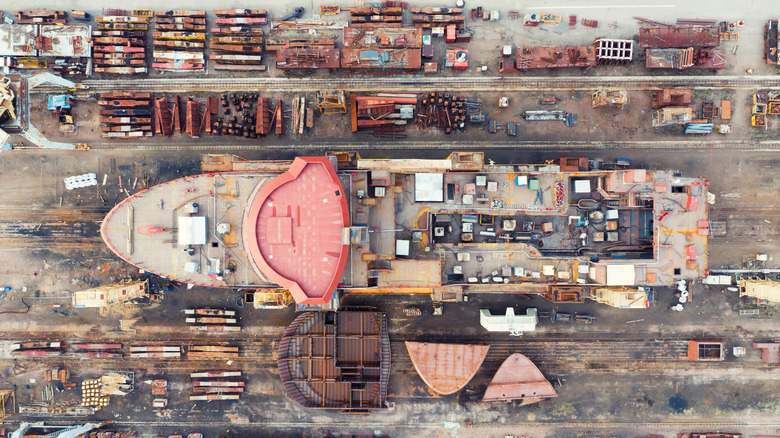 Top-down view of ship being built in dry dock