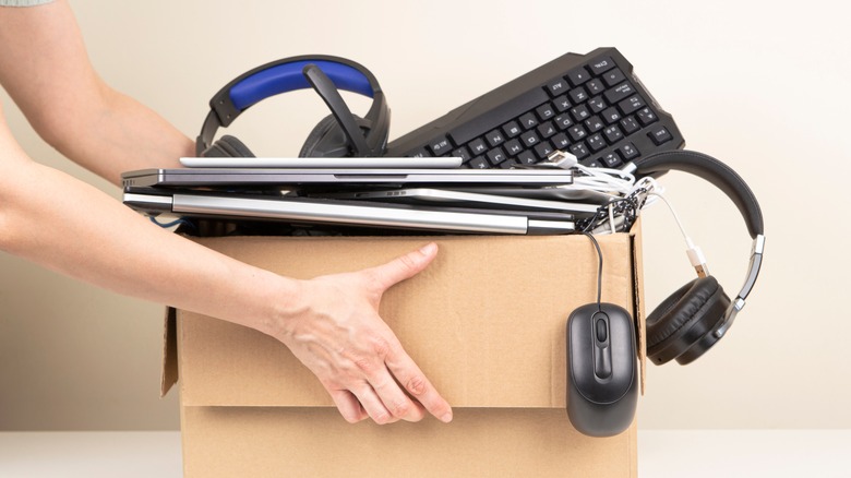 electronic junk in cardboard box