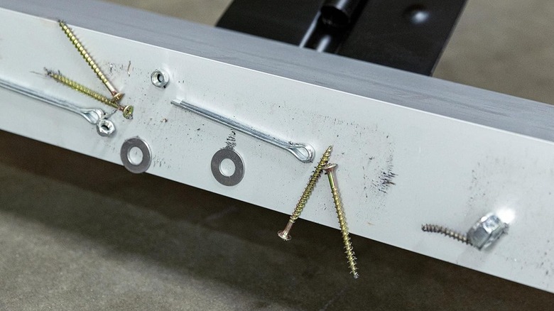 magnetic sweeper tool with screws stuck to it