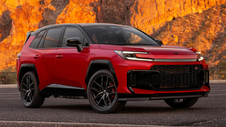 Front 3/4 view of red Toyota RAV4 GR Sport parked in canyon.