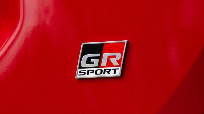 Close-up of GR Sport badge on red Toyota RAV4 GR Sport.