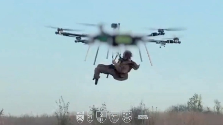 Blurred image of a Ukrainian drone carrying an injured soldier to safety