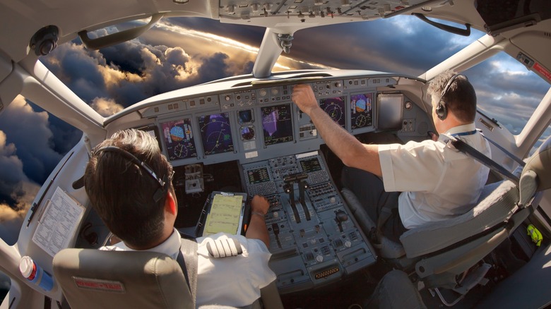 pilots flying a plane