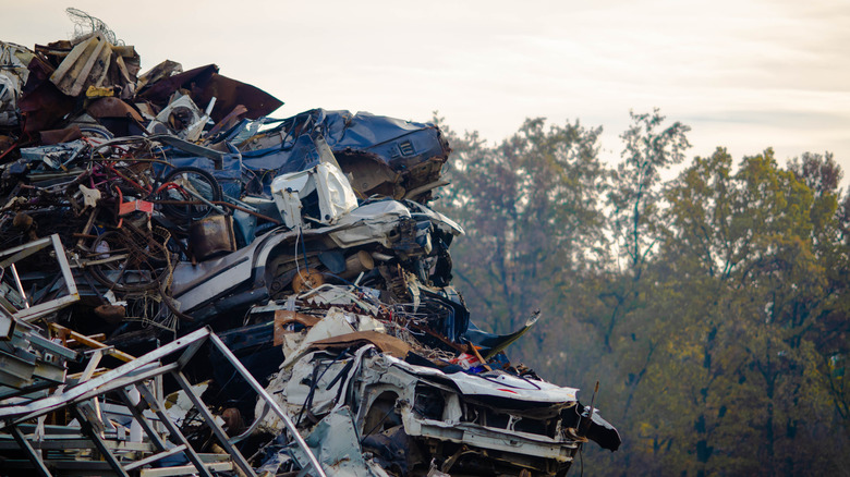 Stacked crushed cars in a scrapyard