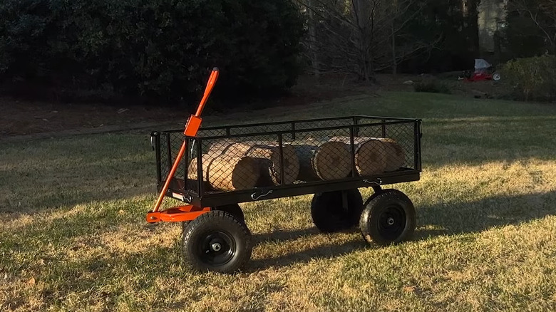 Cart with logs in field