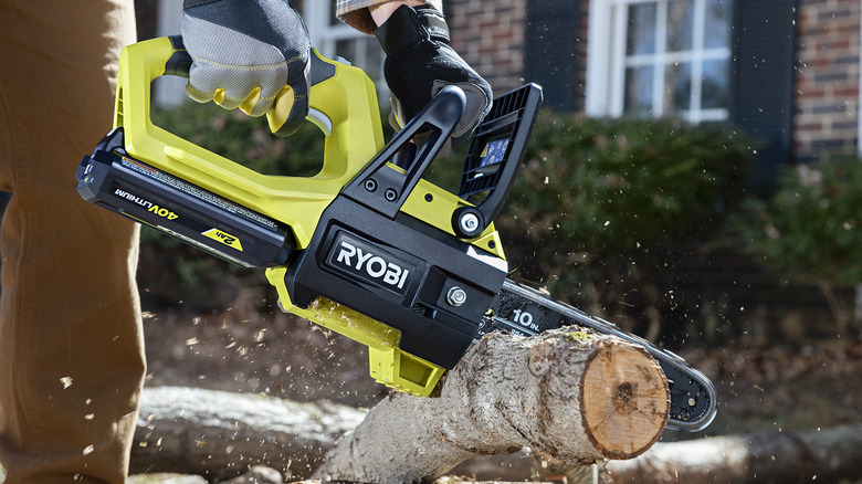 Ryobi 40V chainsaw cutting branch